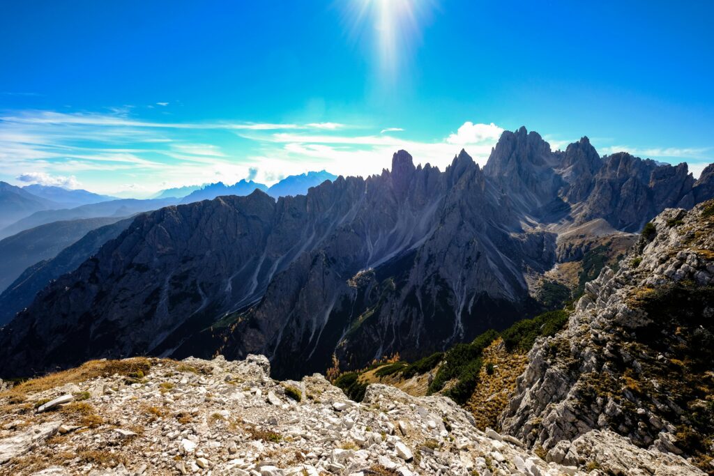 outdoor-image-02 Breathtaking view of the Dolomites mountain peaks under a clear blue sky, perfect for adventure and nature enthusiasts.